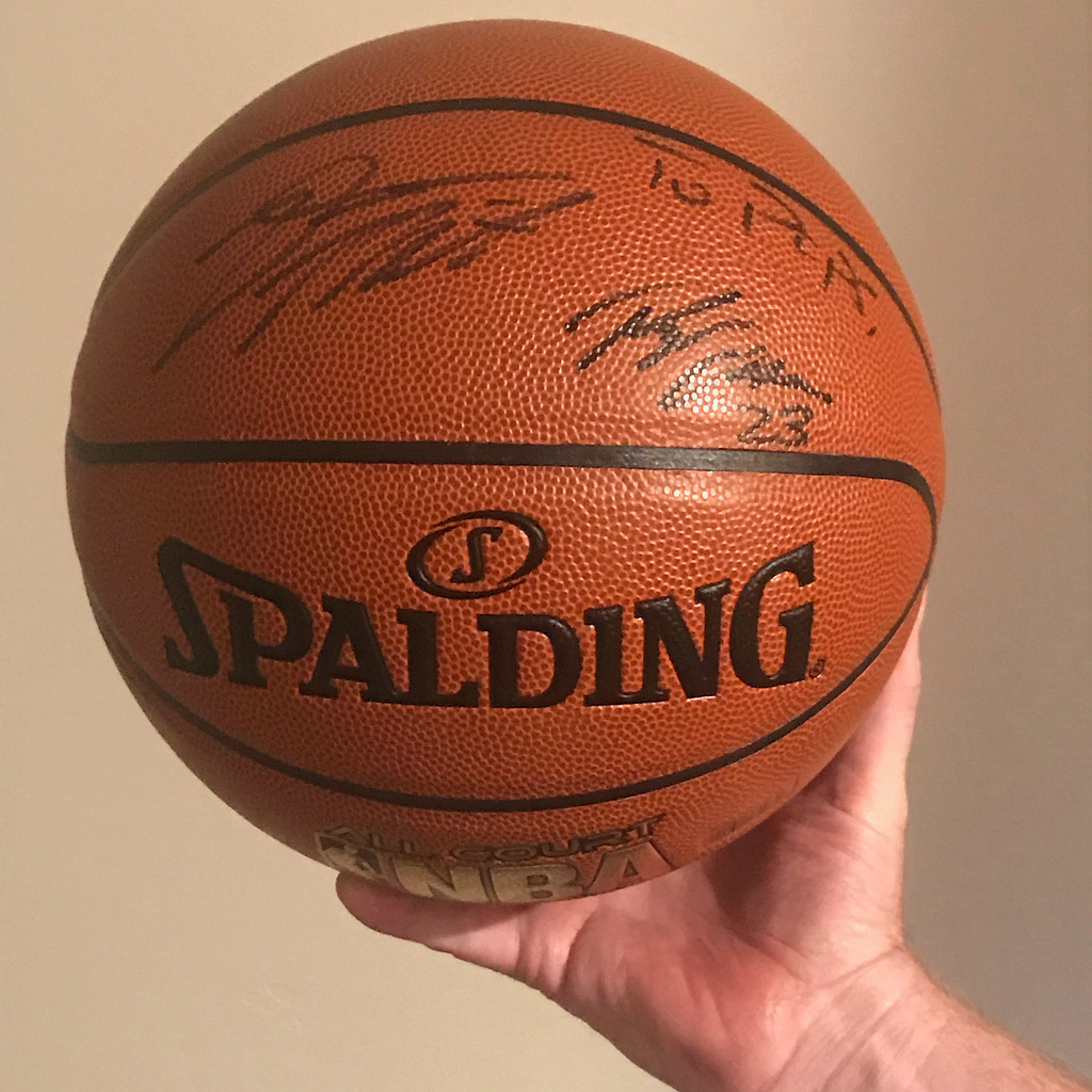 Jeff holds his cherished signed basketball from Utah Jazz players Donovan Mitchell and Royce O’Neale.