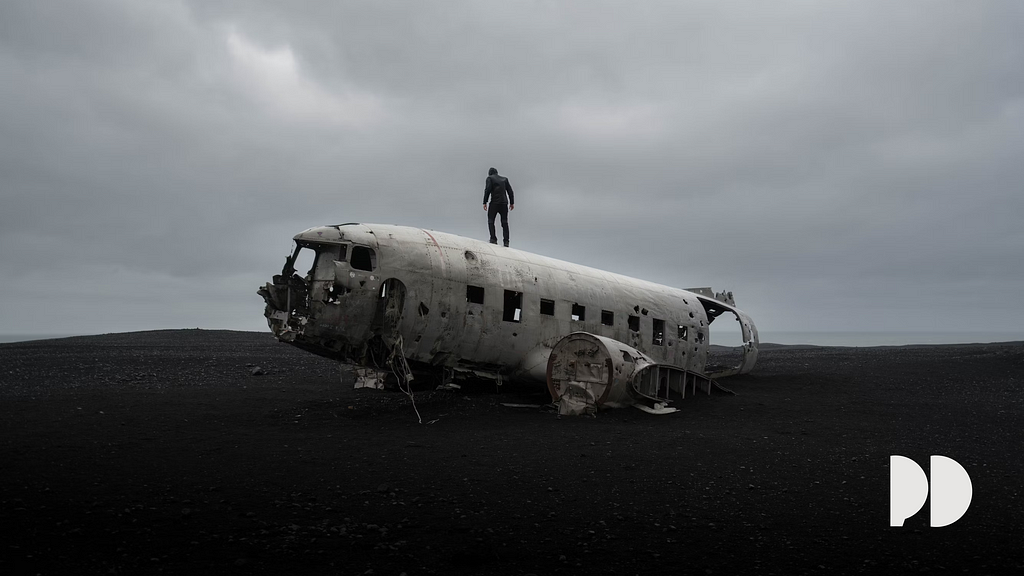 Person standing on a plain wreckage