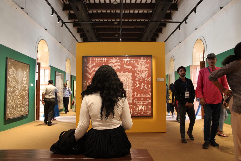 A female sitting in an art gallery!