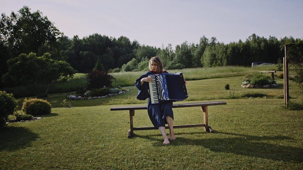 Tuulikki Bartosik with an accordion