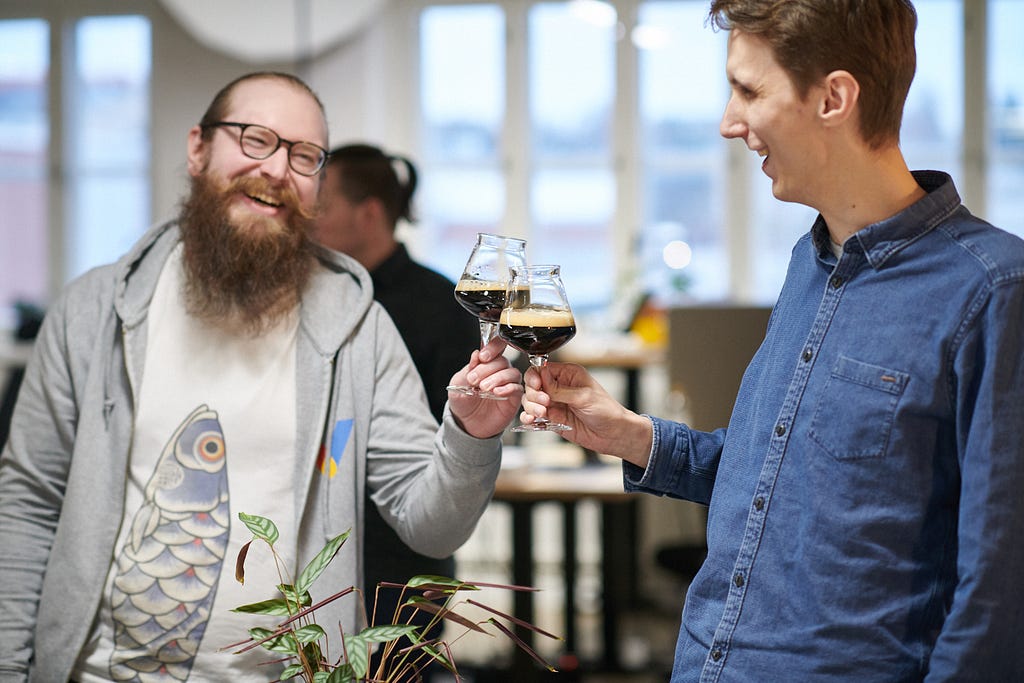 Two competent programmers sharing a dark beer and having a good time