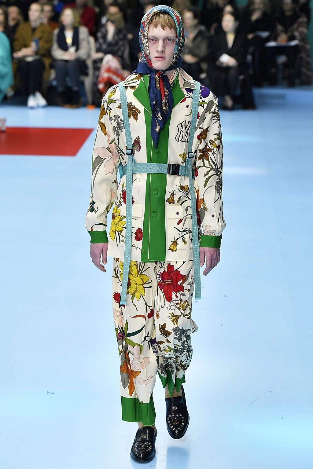 Male model on the fashion show wearing Gucci
