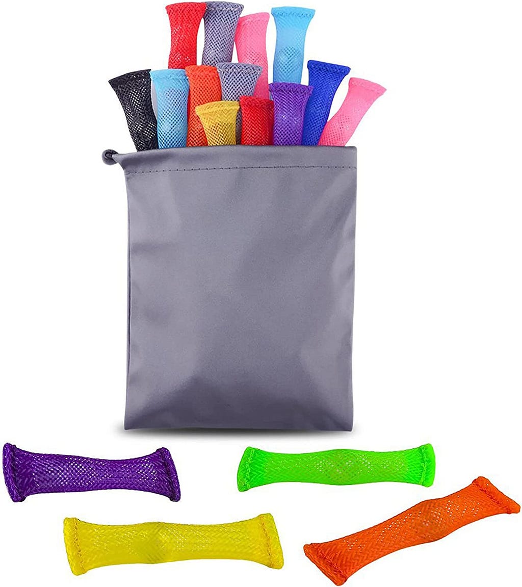 Fabric net tubes with a ball in them, shown as a rainbow colored set in a gray pouch.