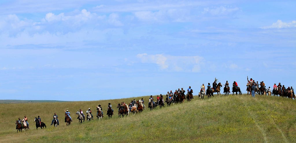 Native American horse riders line up at Little Big Horn