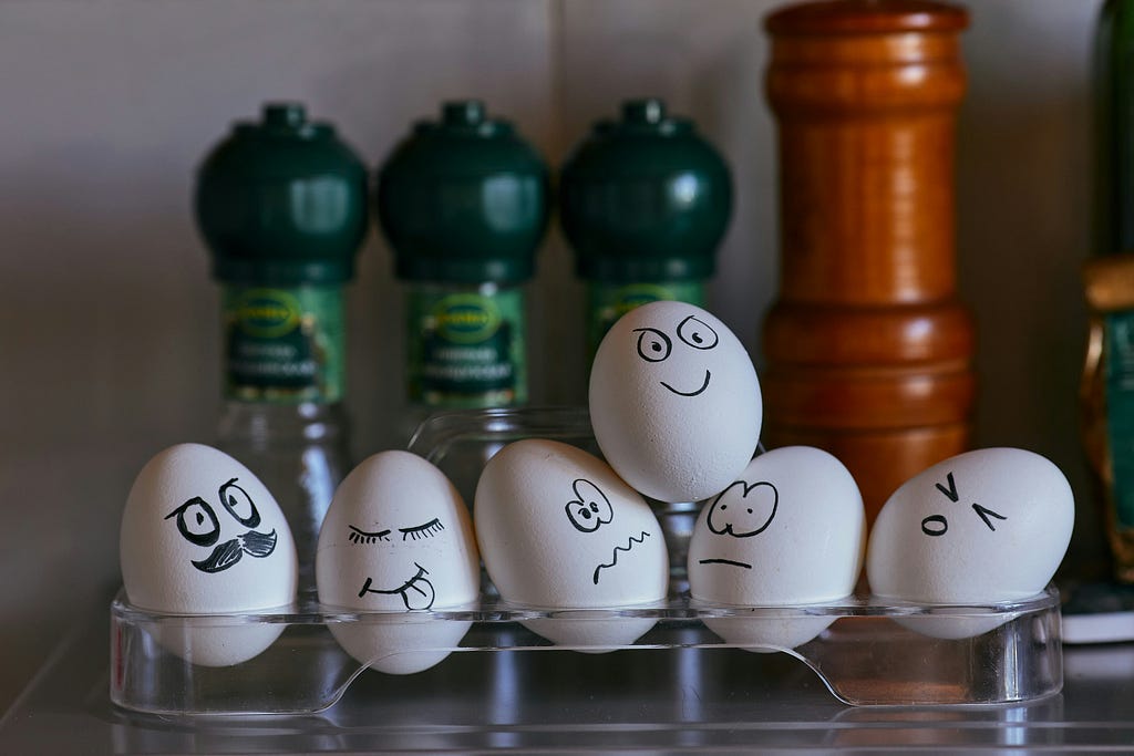 Various eggs painted with faces