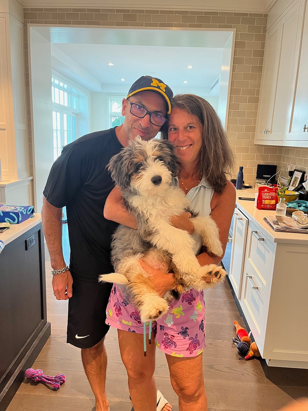 Roger and Carin with their Bernedoodle, Revvy