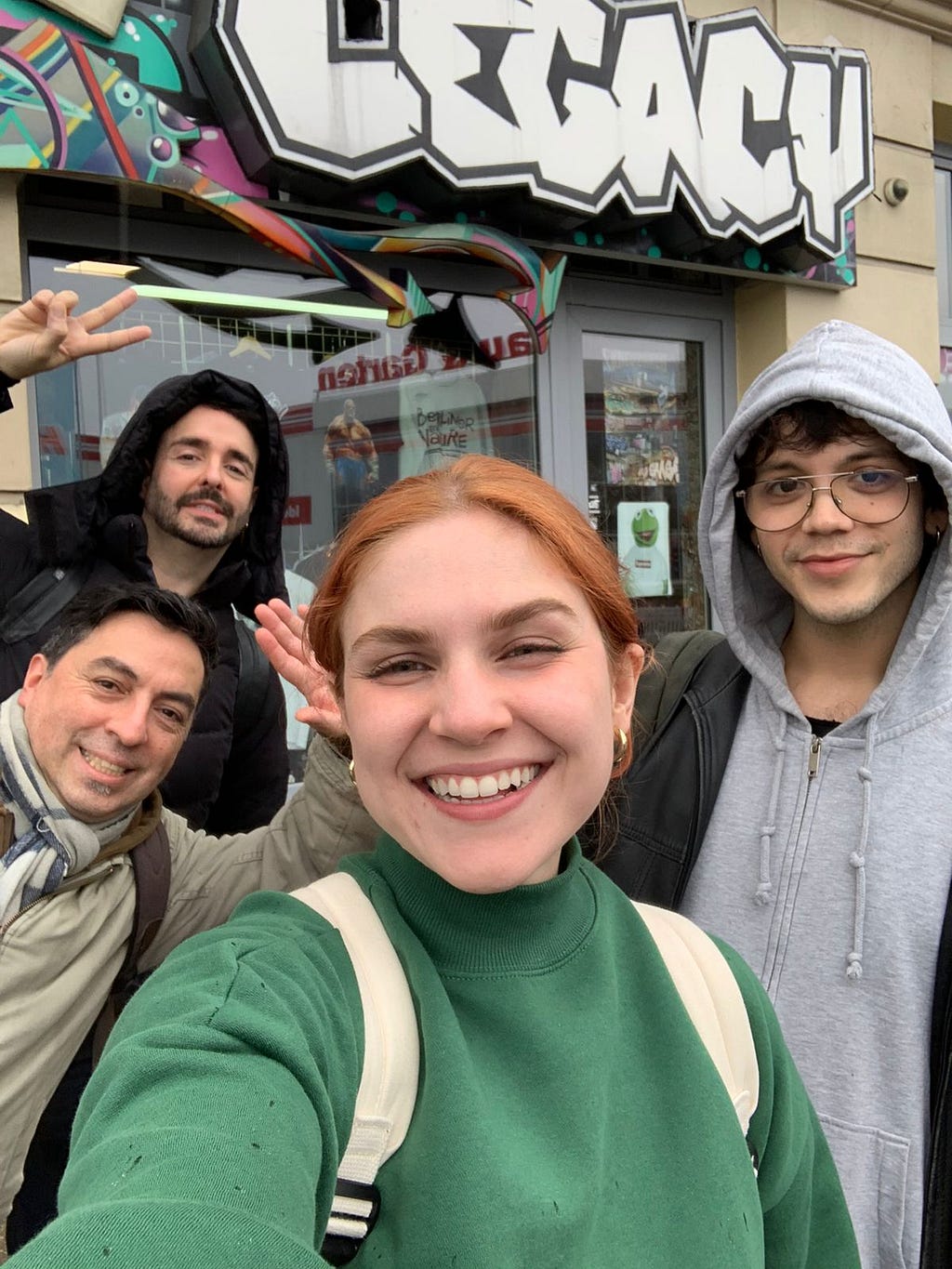 Selfie of the team behind the project. Three men and one woman smiling.