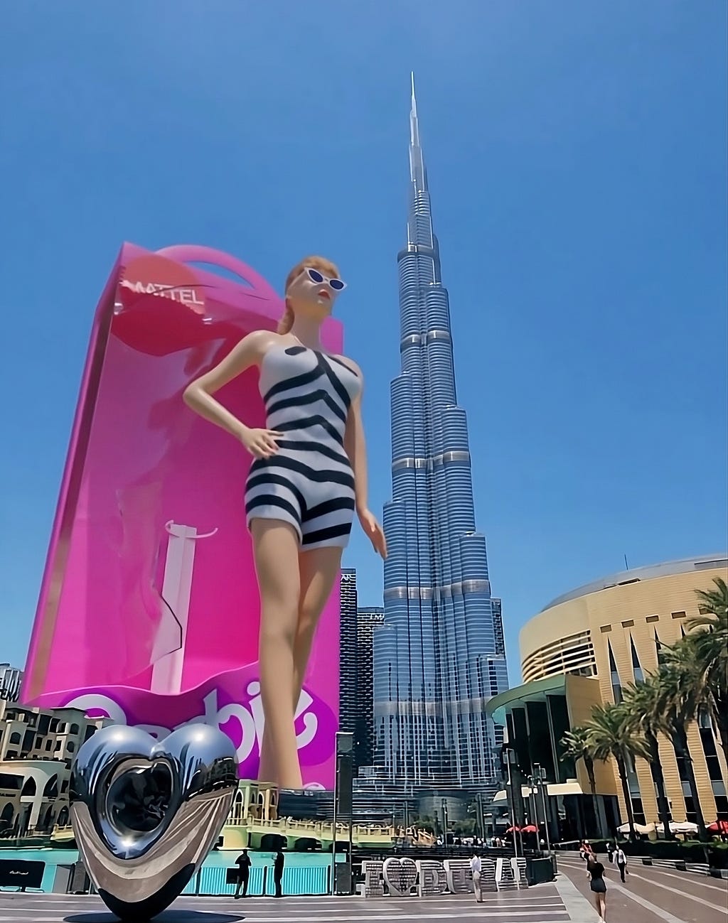 Giant towering Barbie Doll next to the Burj Khalifa in Dubai.