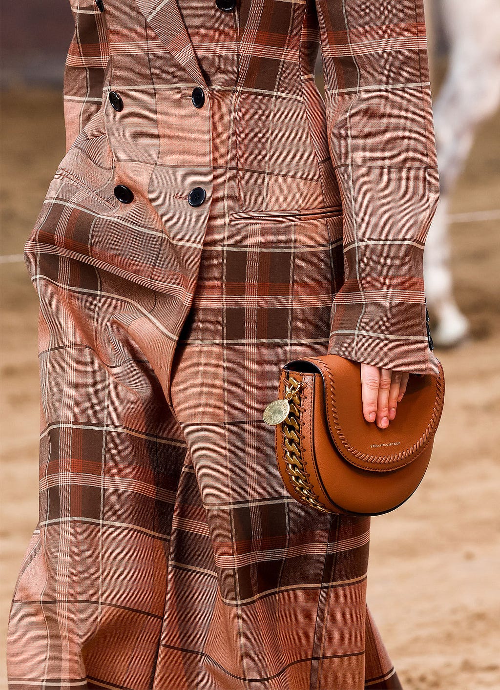 Ginger check suit and Stella McCartney Frayme Ryder Flap Shoulder Bag in MIRUM® on the Winter 2023 runway