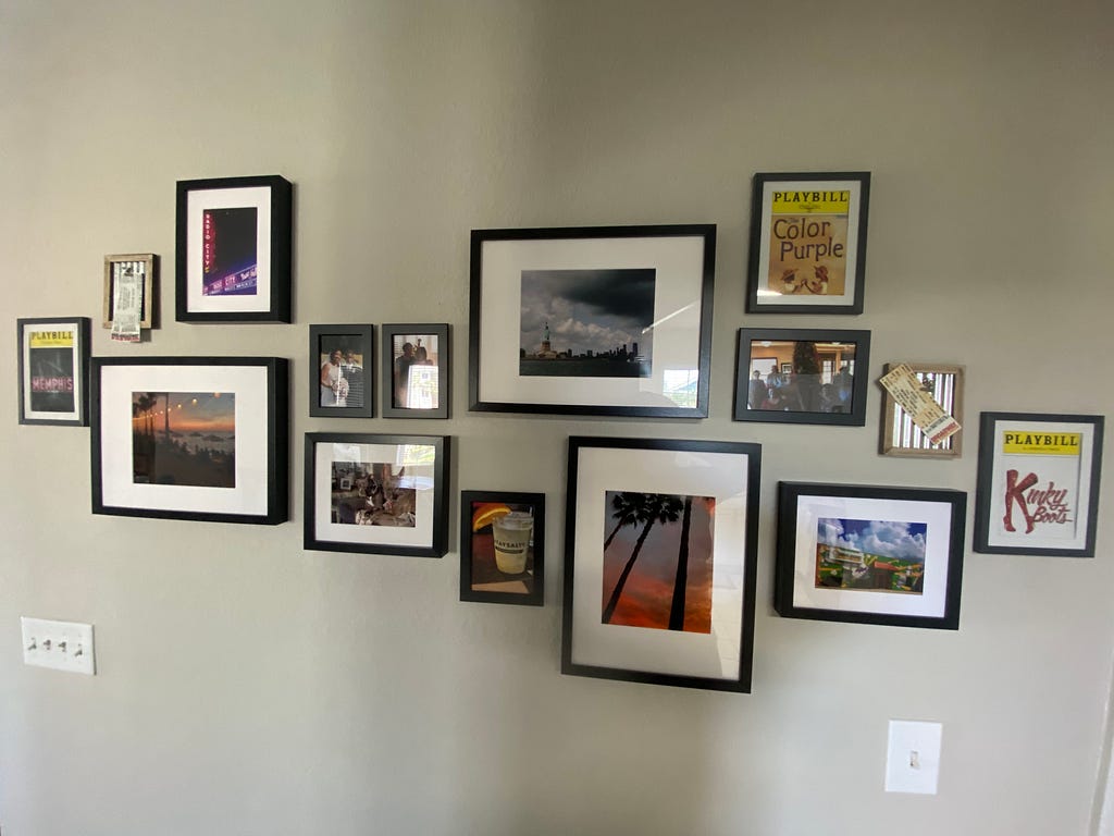 Wall of different pictures of landscapes, tourist attractions, and people.
