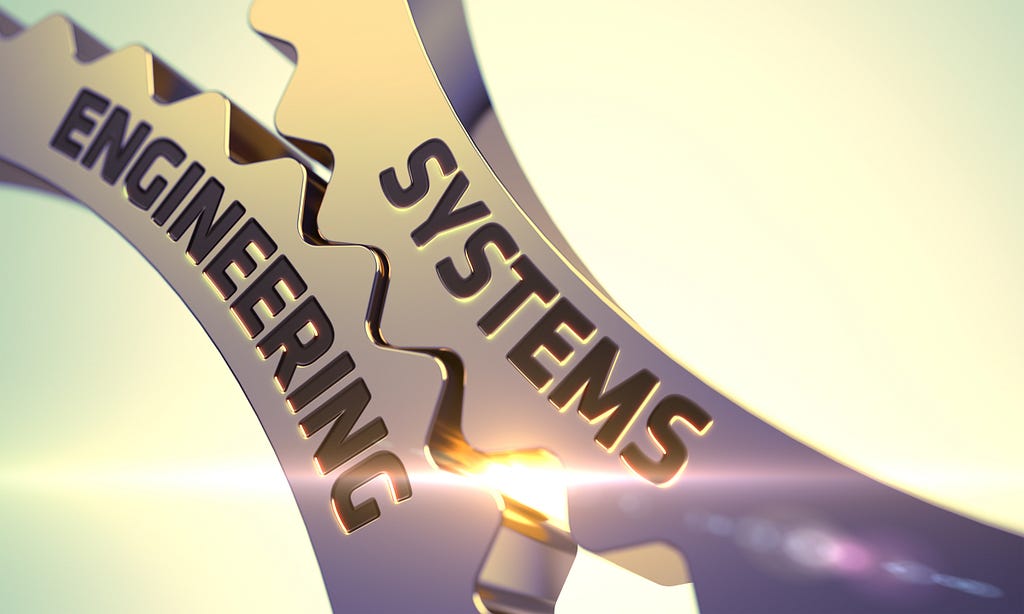 Two Gears Grinding with the Words “Systems” and “Engineering”