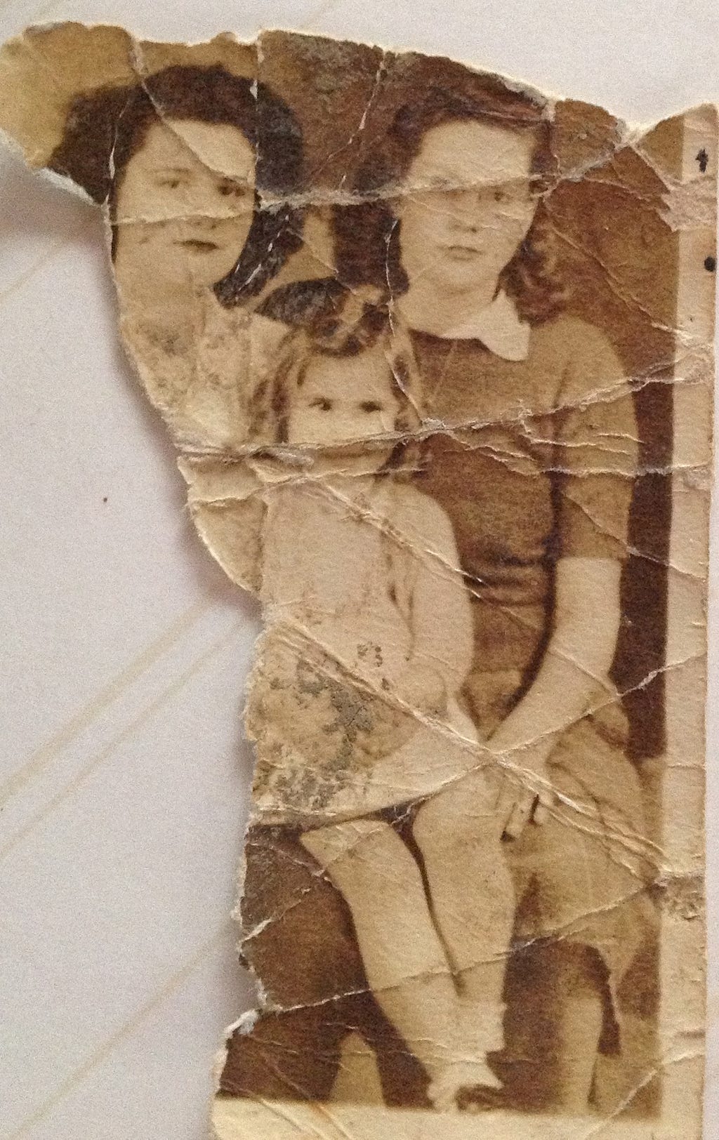 A torn, old family photograph