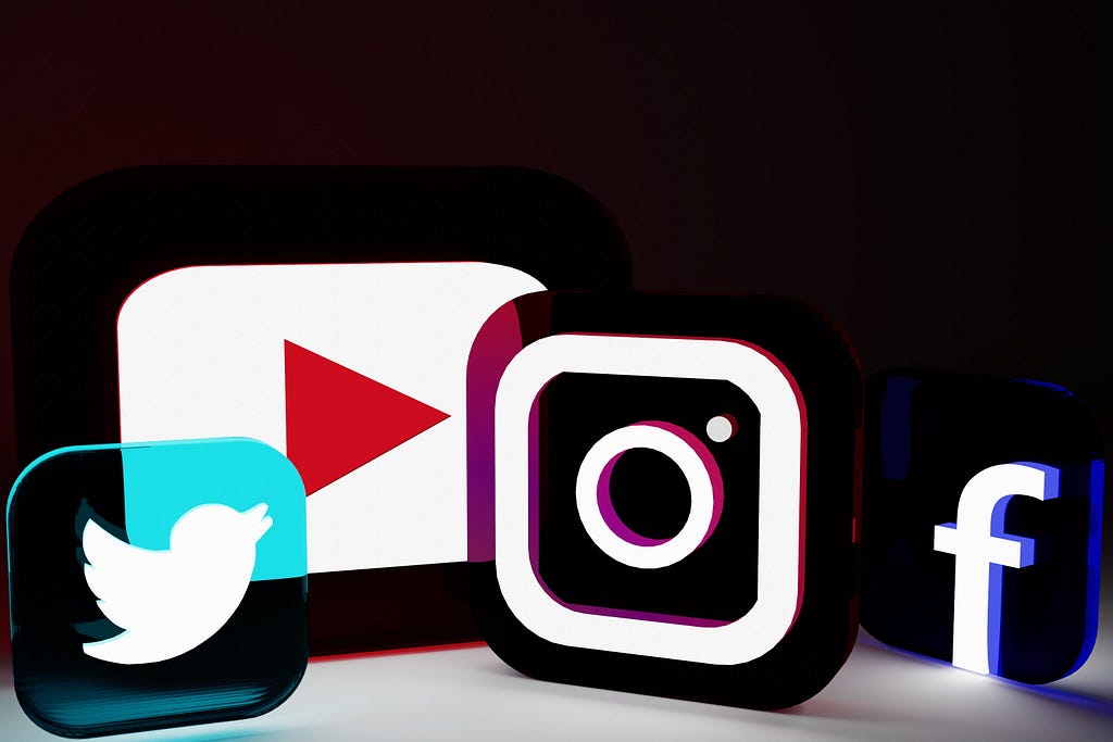 A selection of social media logos, including Twitter, YouTube, Instagram, and Facebook.