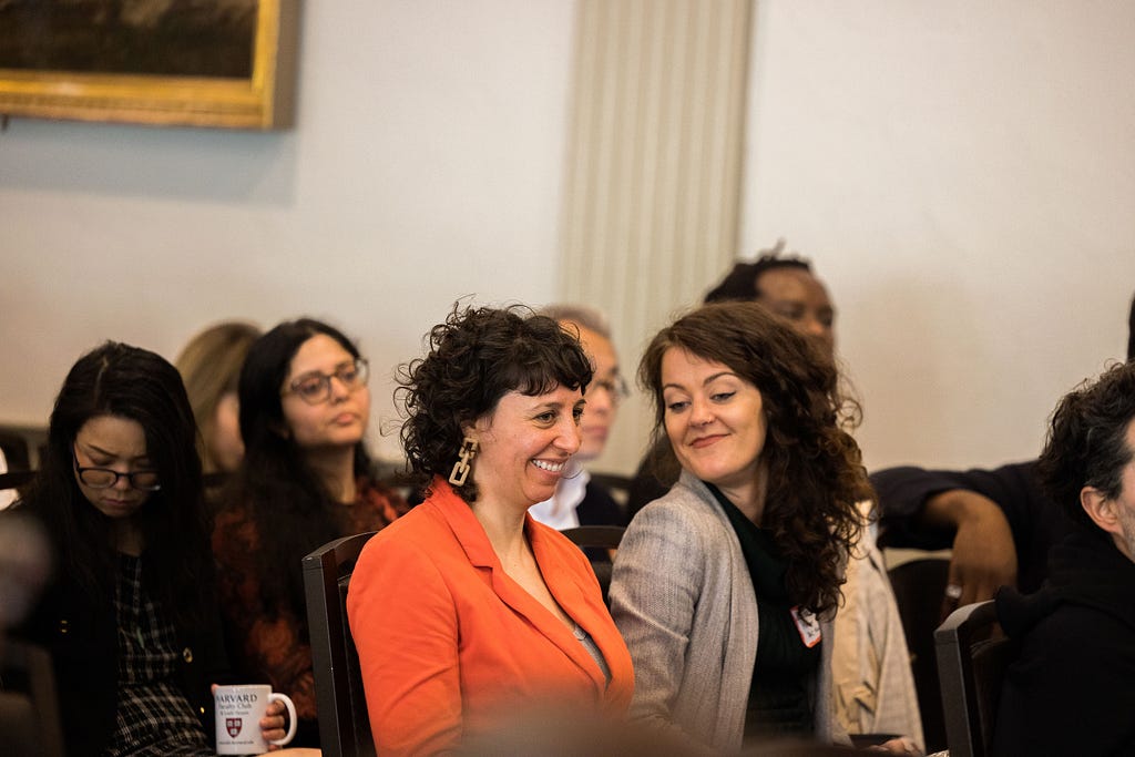 Maroussia Lévesque and Petra Molnar share a moment of levity at “Co-Designing Generative Futures: A Global Conversation about AI,” May 2023.