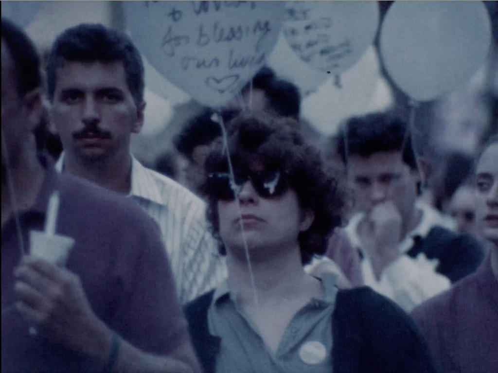 Still: Candlelight Vigil, New York, New York, 1988. Original format 16mm, color, silent.