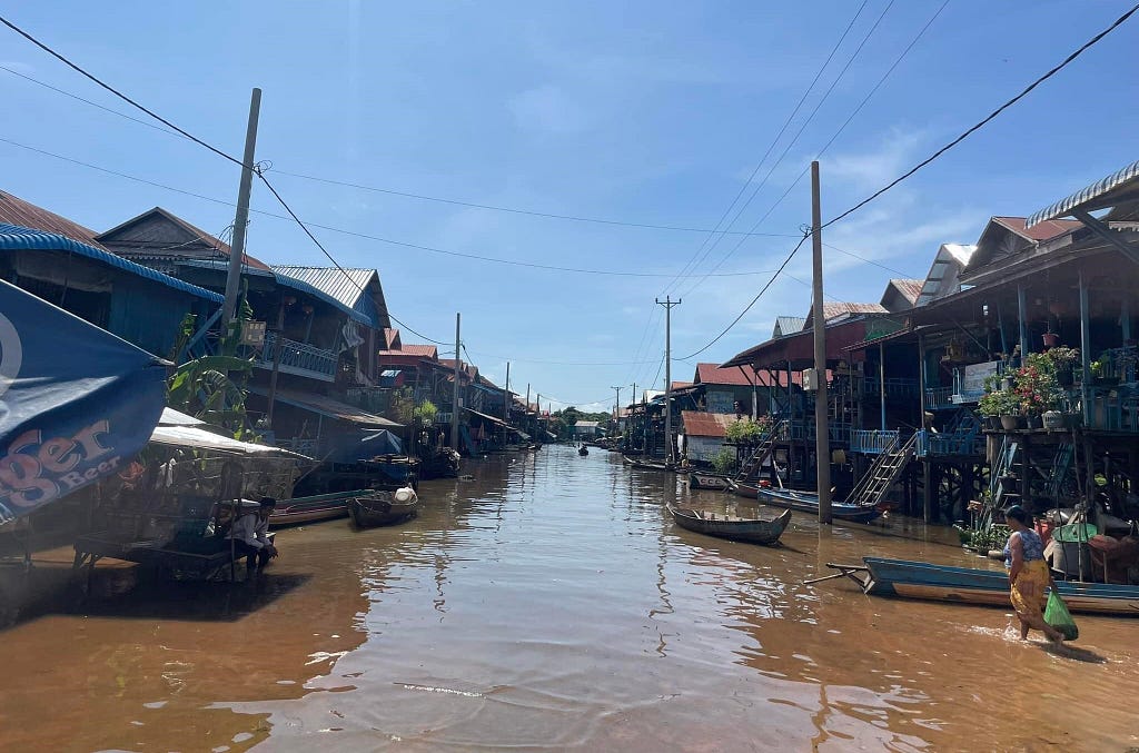 There is water, houses, and boats