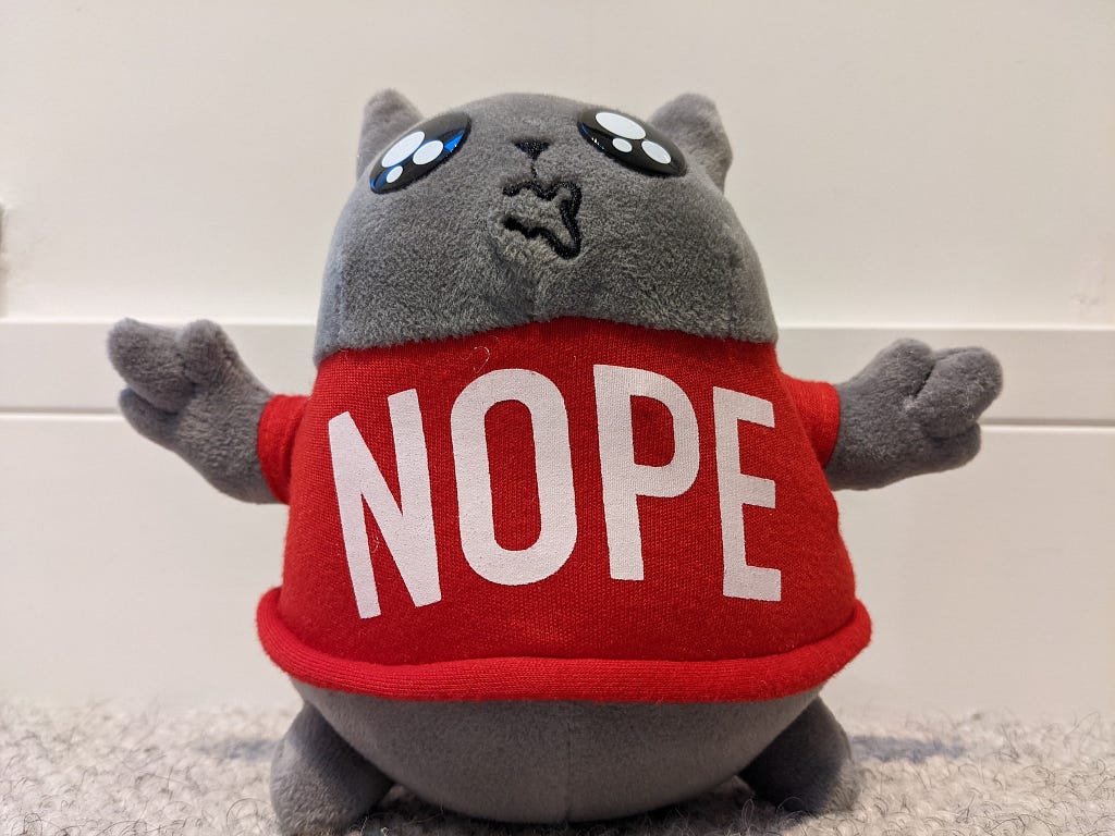 A cuddly toy with a Nope jumper