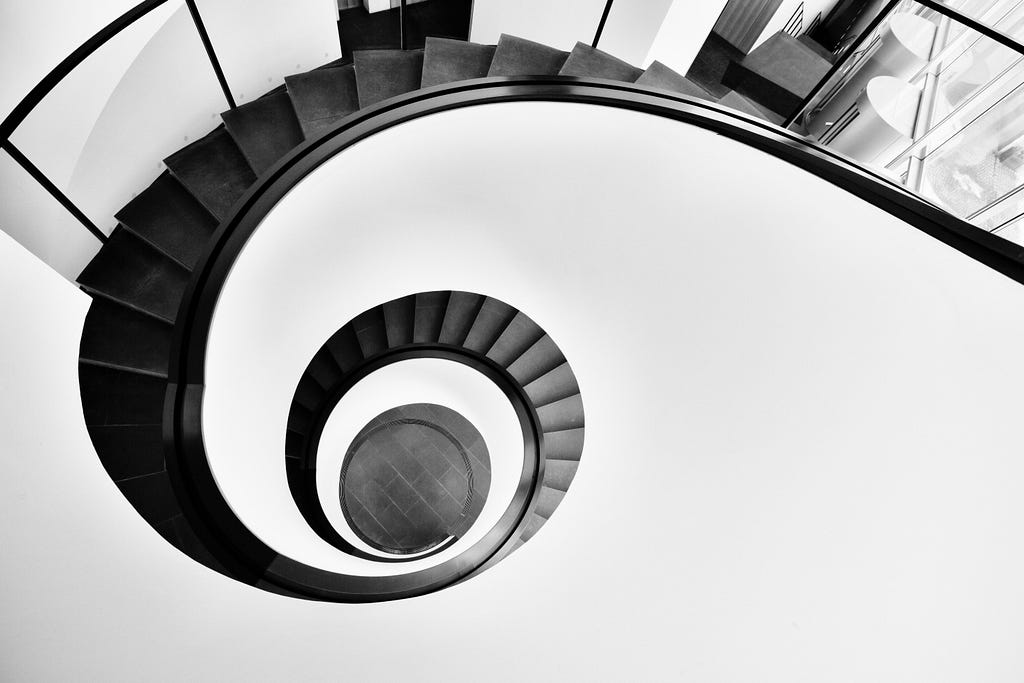 Black & white spiral staircase — aerial shot