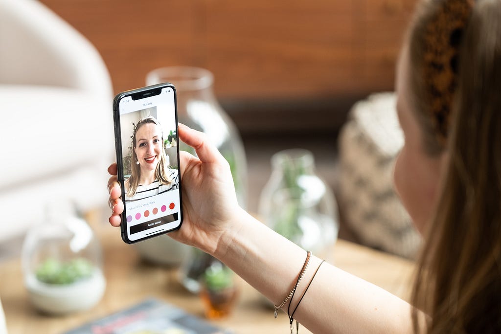 John Lewis Lipstick AR feature — user holds phone in camera mode and see digital lipstick applied to her face