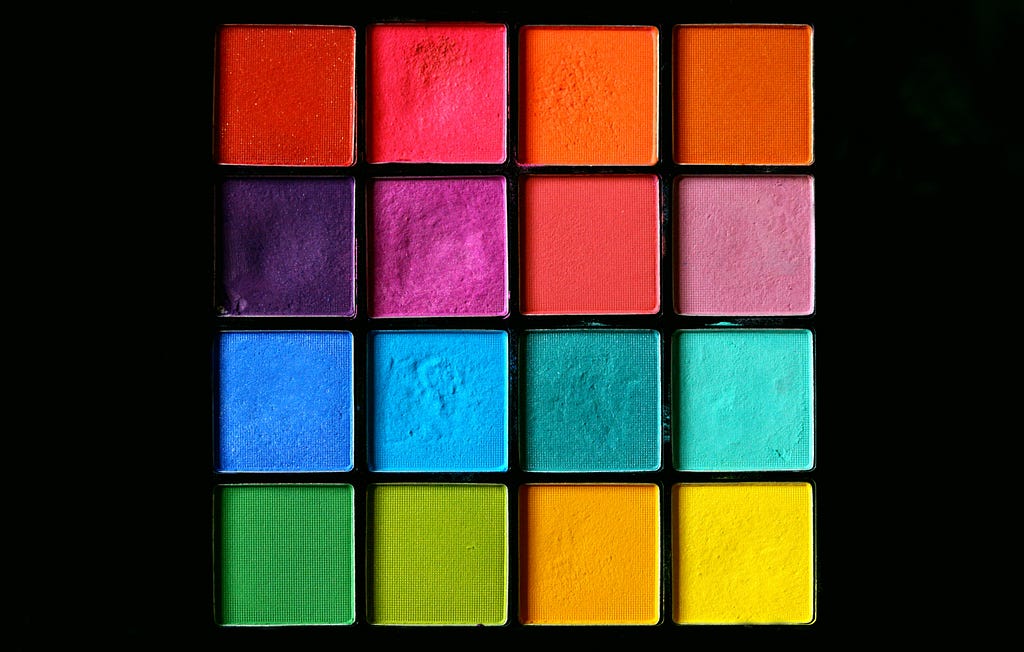 An eyeshadow pallete with sixteen bright colors. Each eyeshadow color represents a different combination of hyperparameter values.