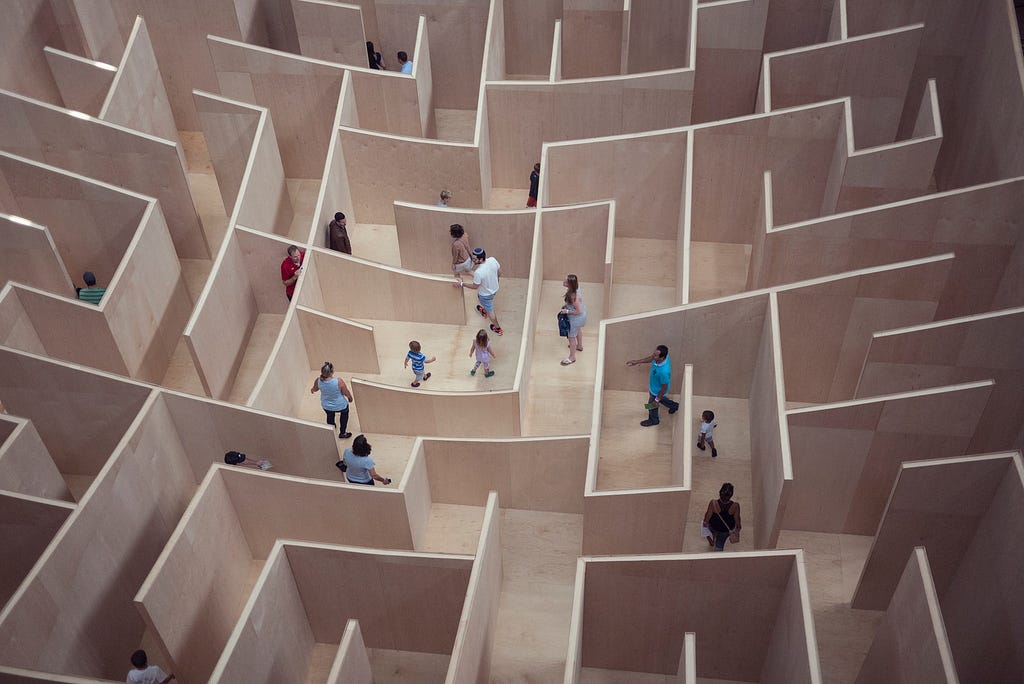People walking around in a maze