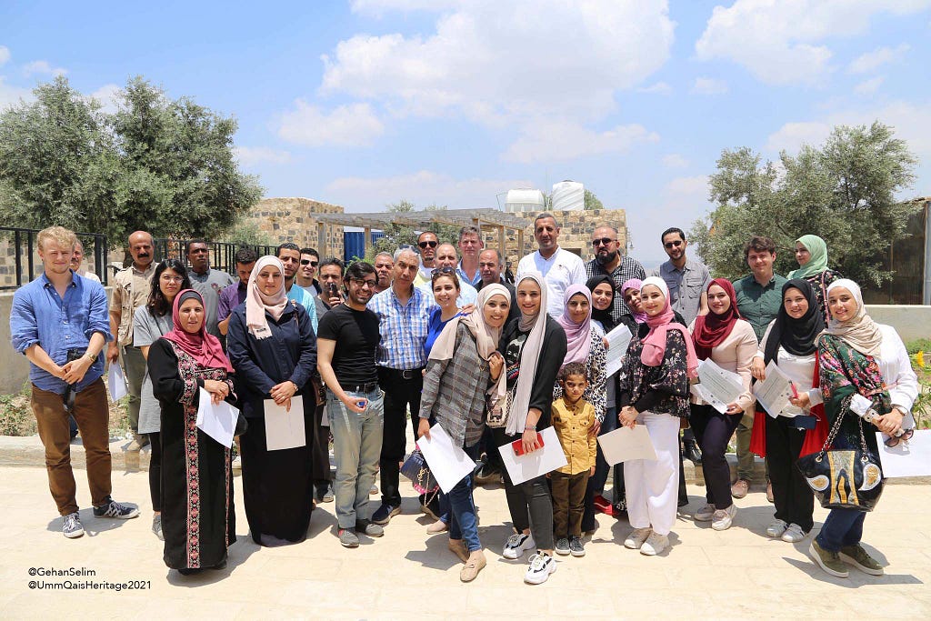 A group of students and staff in Umm Qais, who have been involved in capturing the history of the site, and co-creating arts and crafts with local industries.