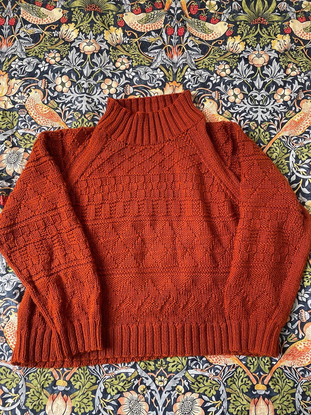 A rust coloured knitted jumper