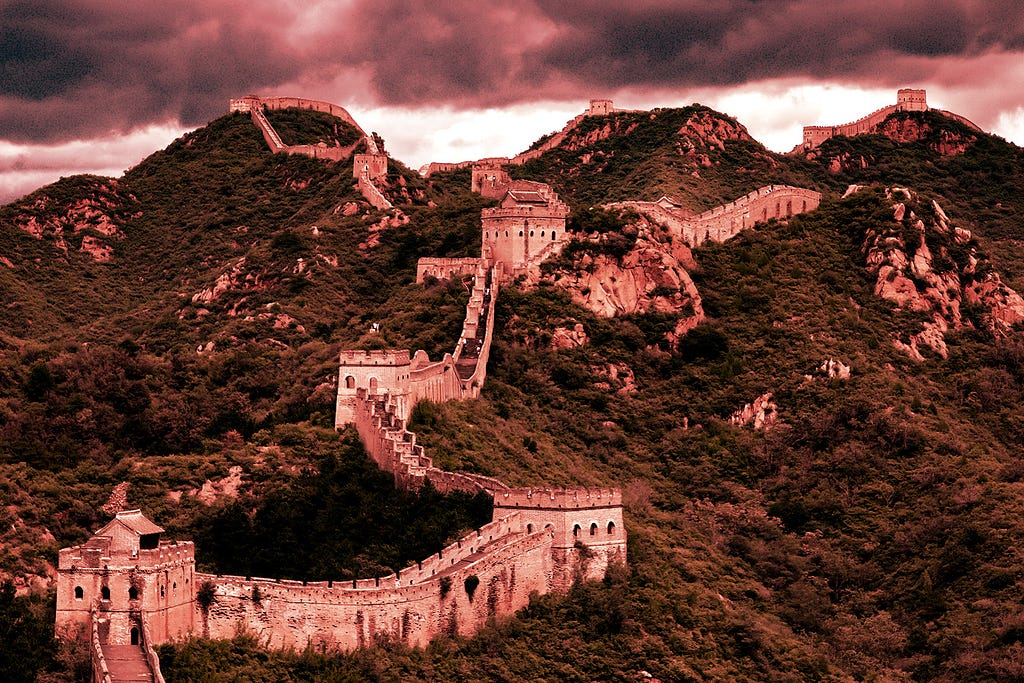 The Great Wall of China and surrounding hills overlaid with a red filter.