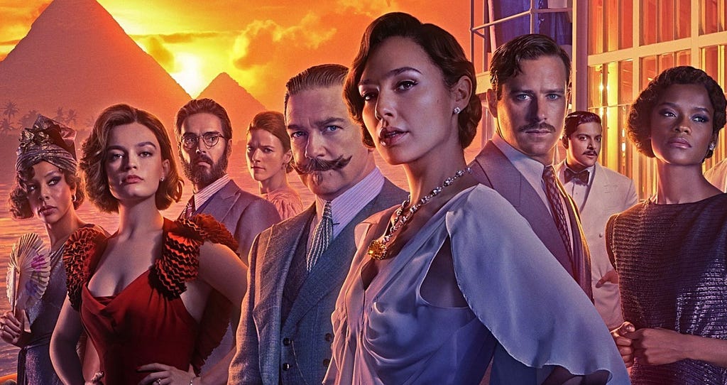 Cast of Characters in Death on the Nile (2022), from left to right: Emma MacKay, Russell Brand, Rose Leslie, Kenneth Branagh, Gal Gadot, Armie Hammer, Ali Fazal and Letitia Wright.