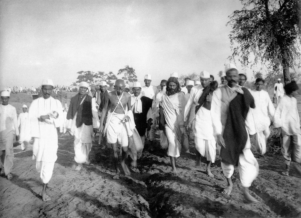 A picture of Gandhi and his followers during the salt march