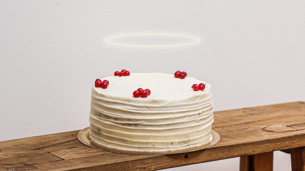 A decorated cake with a halo over it.
