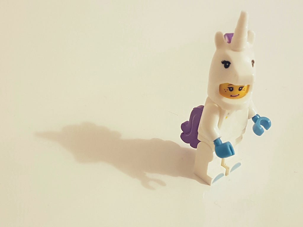 lego man dressed as unicorn