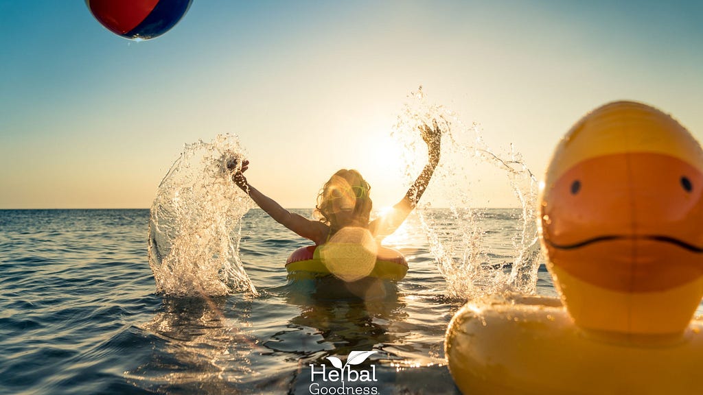 Happy person floating on a water float in summer