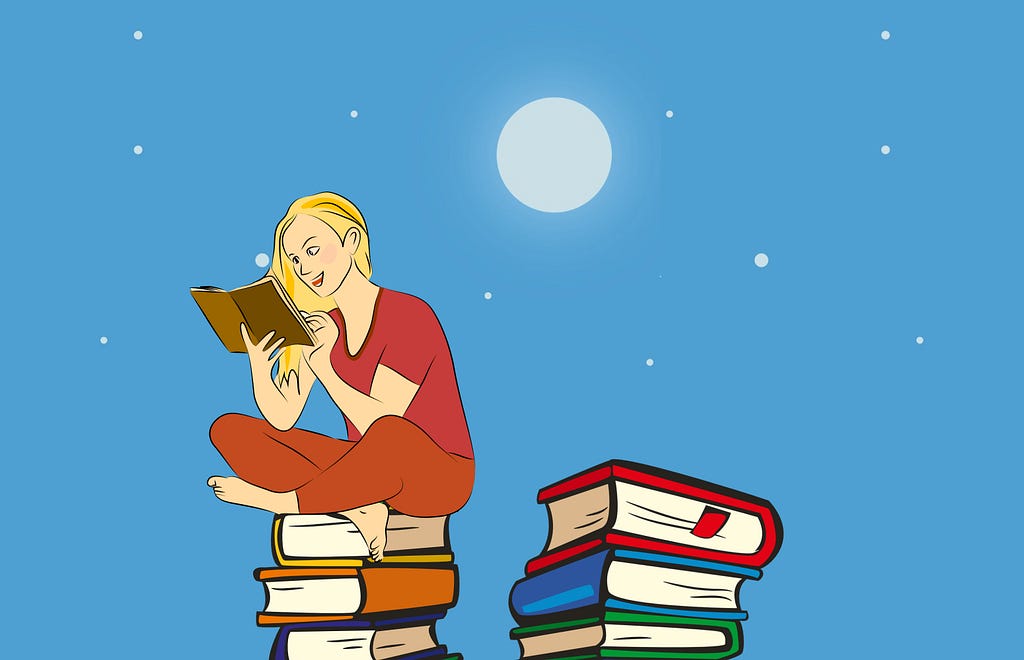 A woman sits on top of two tall piles of books. She reads from one.
