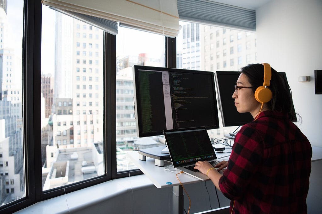 React Js Programmer looking out of the window