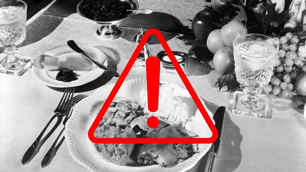 Black-and-white vintage photo of a Thanksgiving dinner; overlaid on it is a red triangle with an exclamation mark.