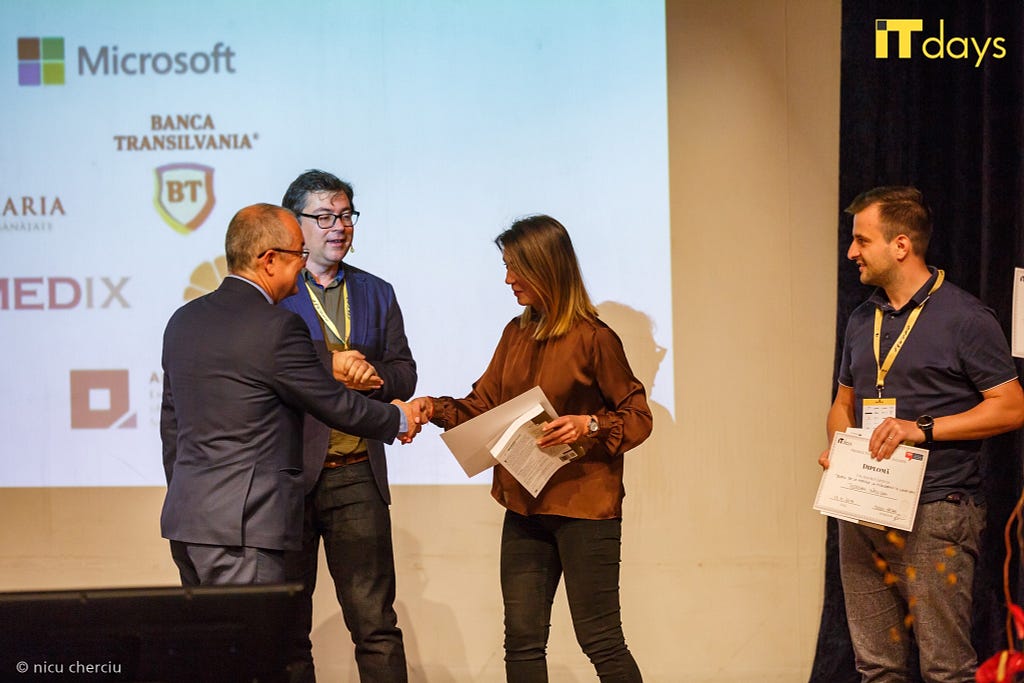 The Mayor of Cluj-Napoca, Emil Boc, Awarding Paula, Wolfpack Digital project manager for the most popular tech article 2019