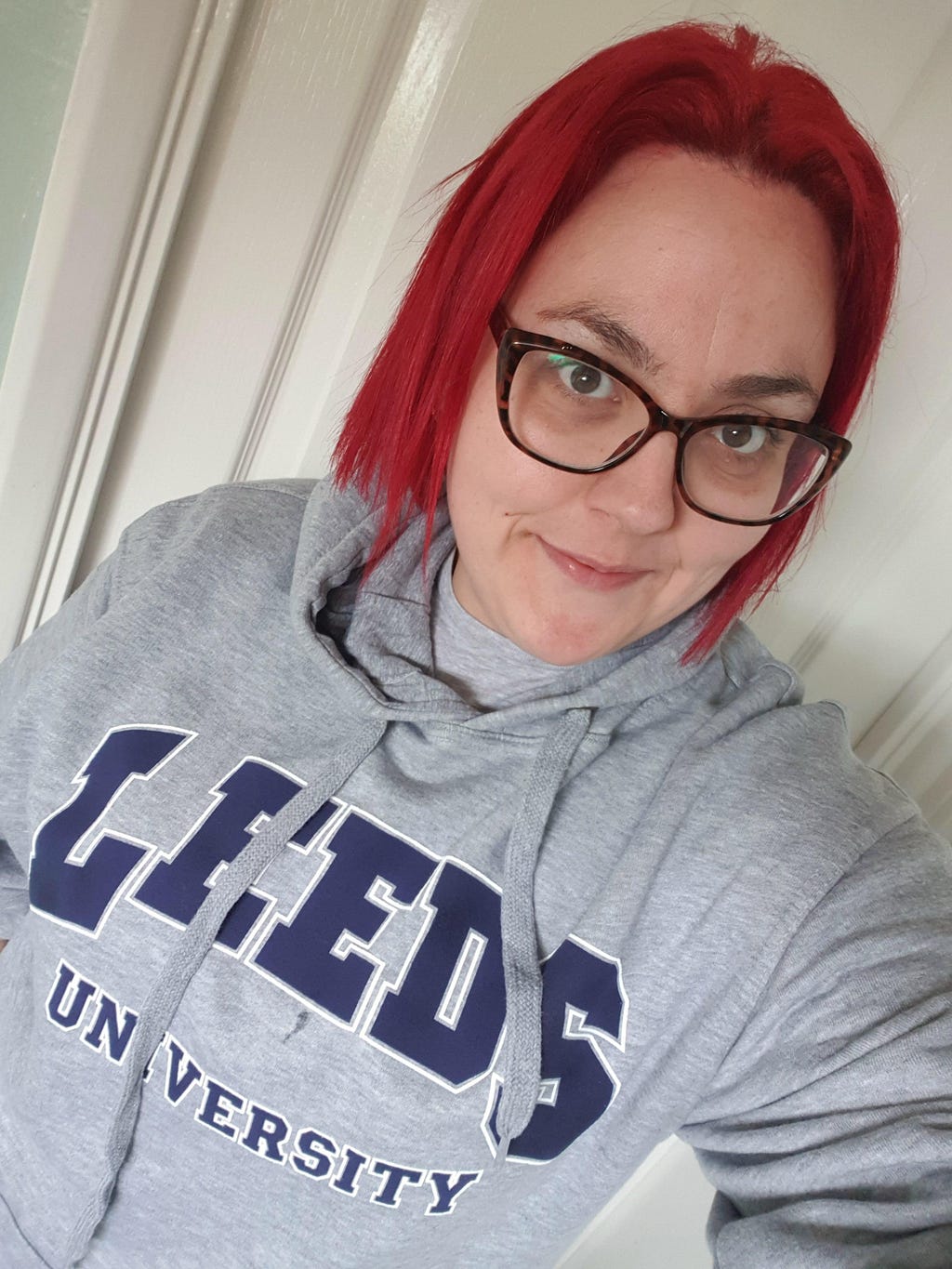 A ‘selfie’ image of Emily wearing a University of Leeds branded sweatshirt.