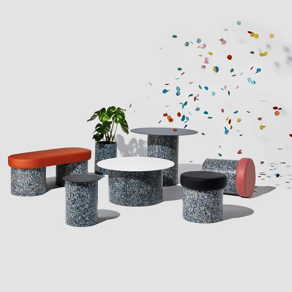 A colourful set of children’s furniture made from recycled plastic. Confetti rains from the ceiling.