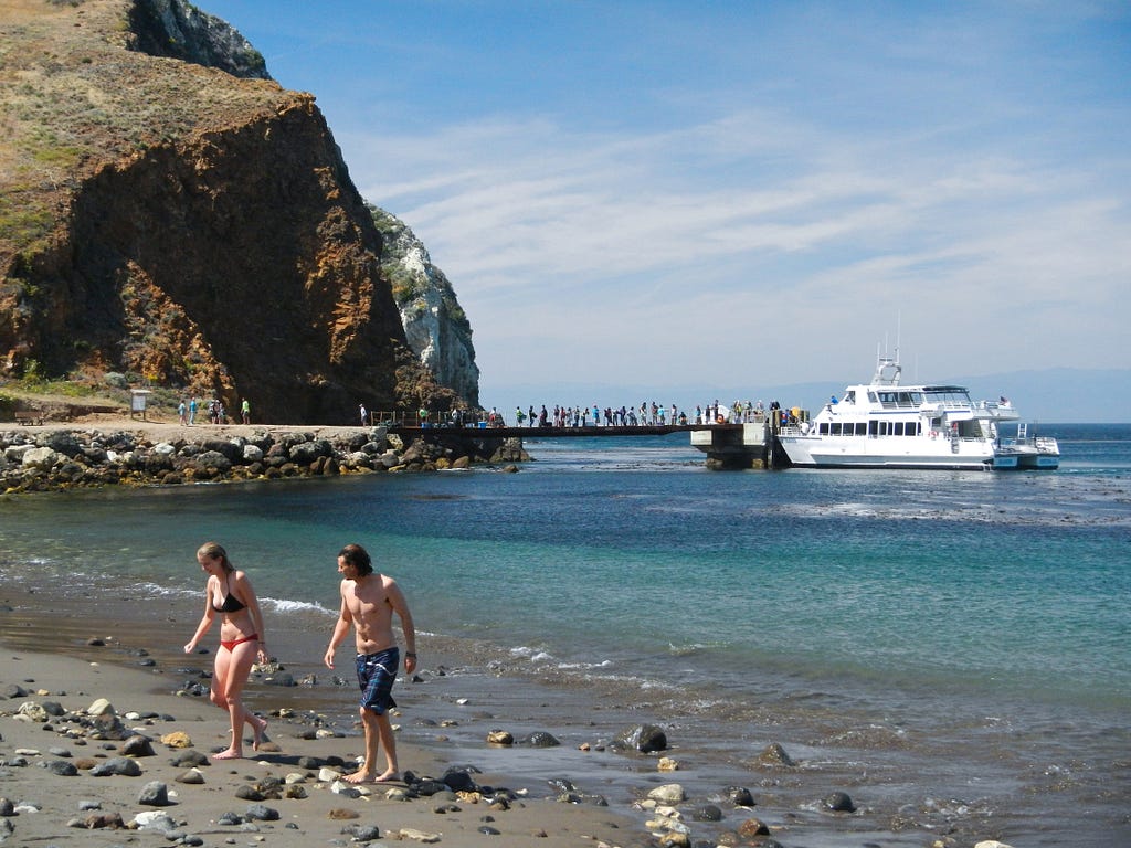 While the Island Packers ferry unloads hikers and campers, swimmers emerge from a brisk dip in Scorpion Harbor on California’s Santa Cruz Island in Channel Islands National Park. (copyright April Orcutt — all rights reserved)