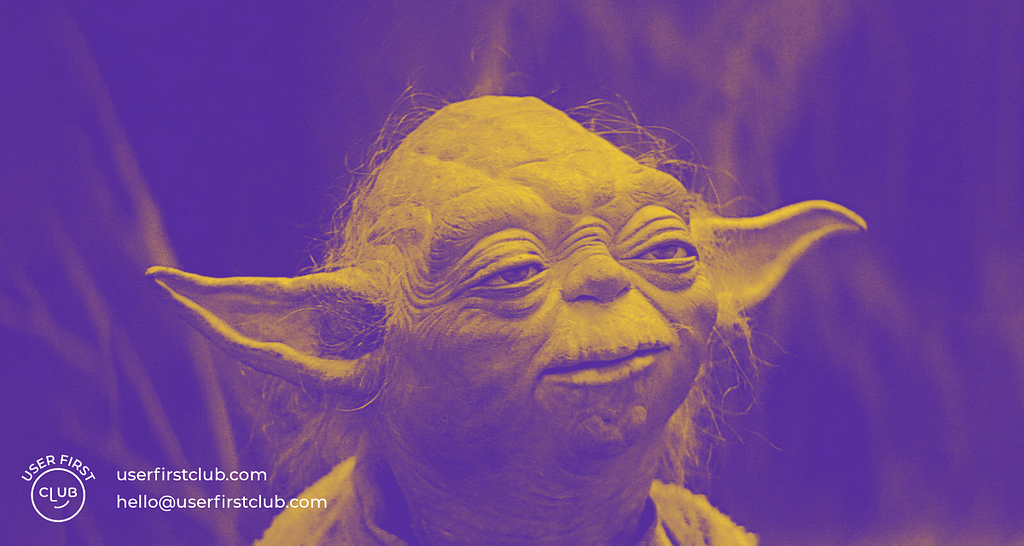 A duotone image of Master Yoda with the User First Club logo and contact details displayed on the left bottom corner.