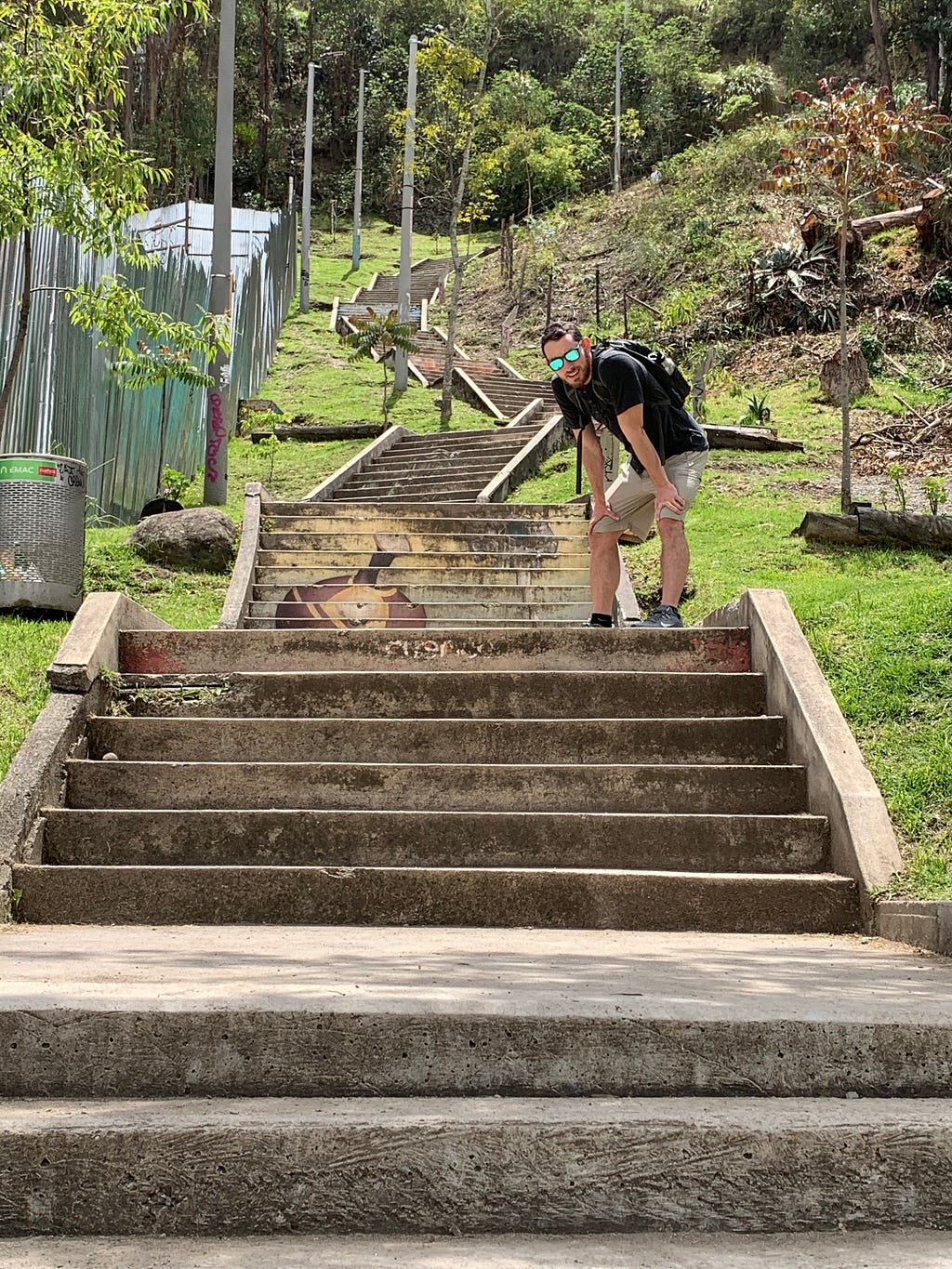 Brandon resting on the steep steps leading to the Mirador in Cuenca, Ecuador.