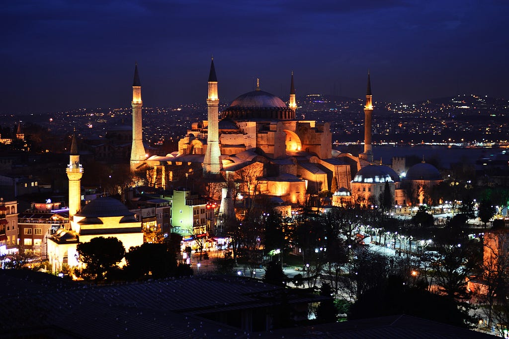 The Hagia Sophia at night. (The four outer towers, minarets, would have been added later during the Ottaman Empire.) Image by vedat zorluer from Pixabay.