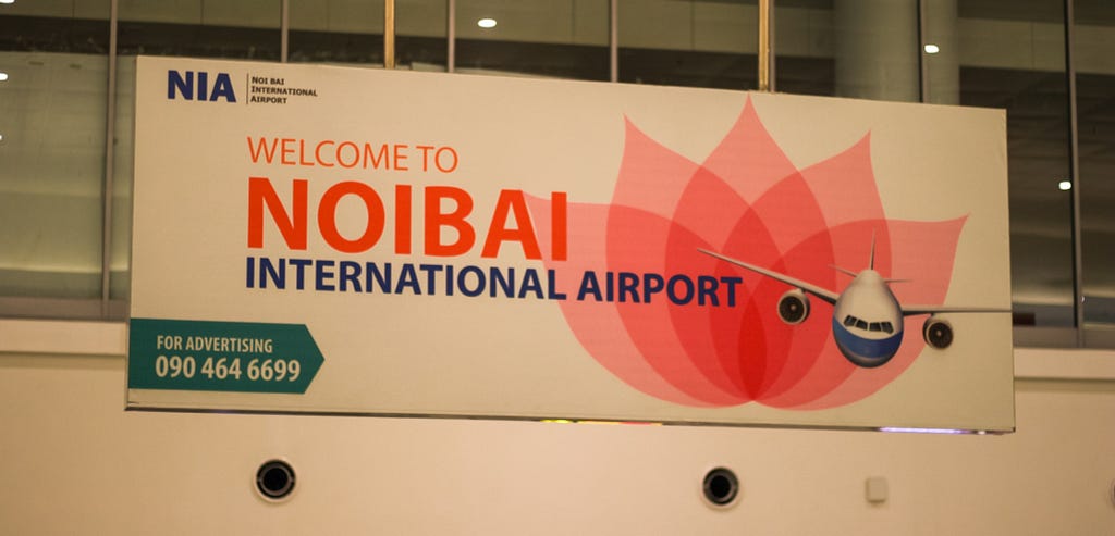 A photograph of a welcome sign at Noi Bai International Airport in Hanoi