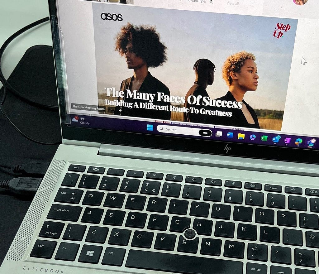 An image of a laptop showing a presentation titled ‘The Many Faces of Success: Building a Different Route to Greatness’.