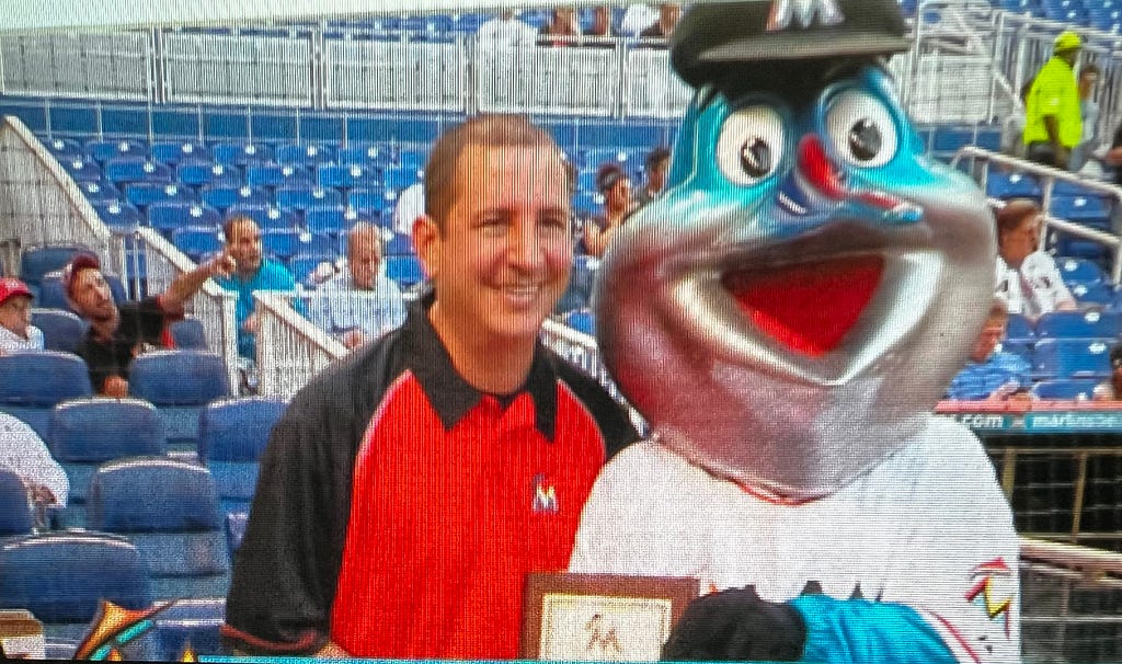 author with Billy the Marlin mascot at baseball game