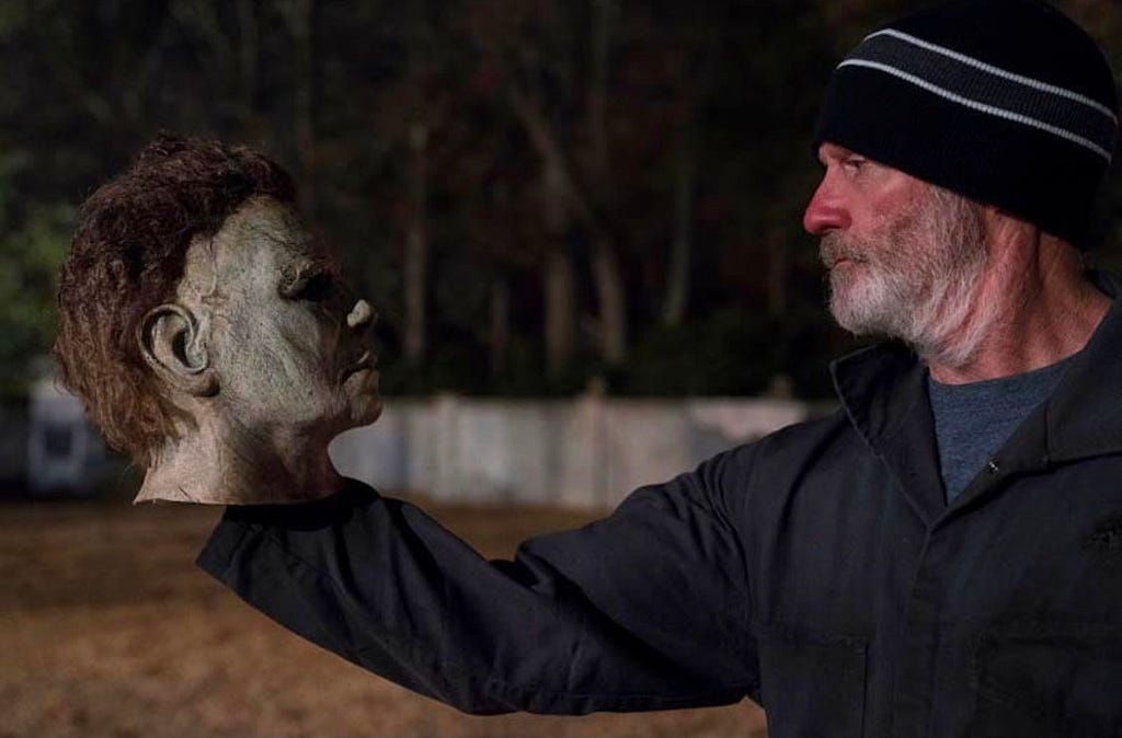 James Jude Courtney holding Michael Myers Mask on-set of Halloween 2018
