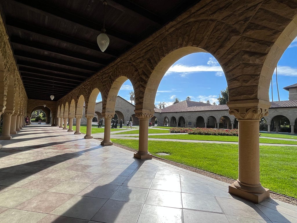 A picture of Stanford’s main quad, taken under the famous arches
