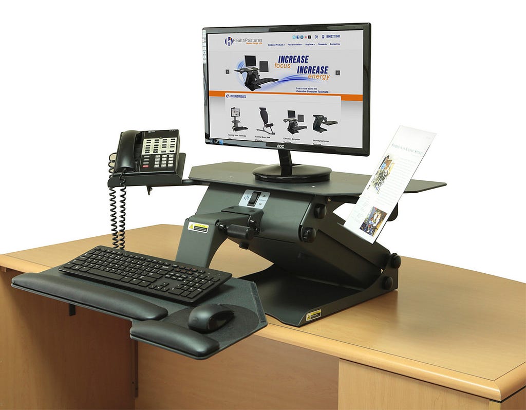 Example of ergonomic workstation, with monitor at head level and keyboard closer to body.