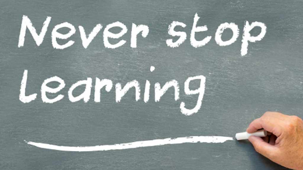 Chalkboard with the words Never stop Learning with Learning underlined